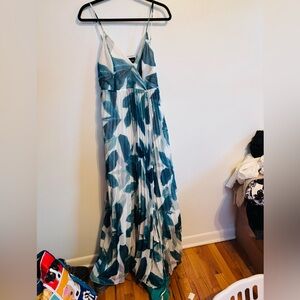 The Sang white palm leaf printed maxi wrap dress with spaghetti straps.